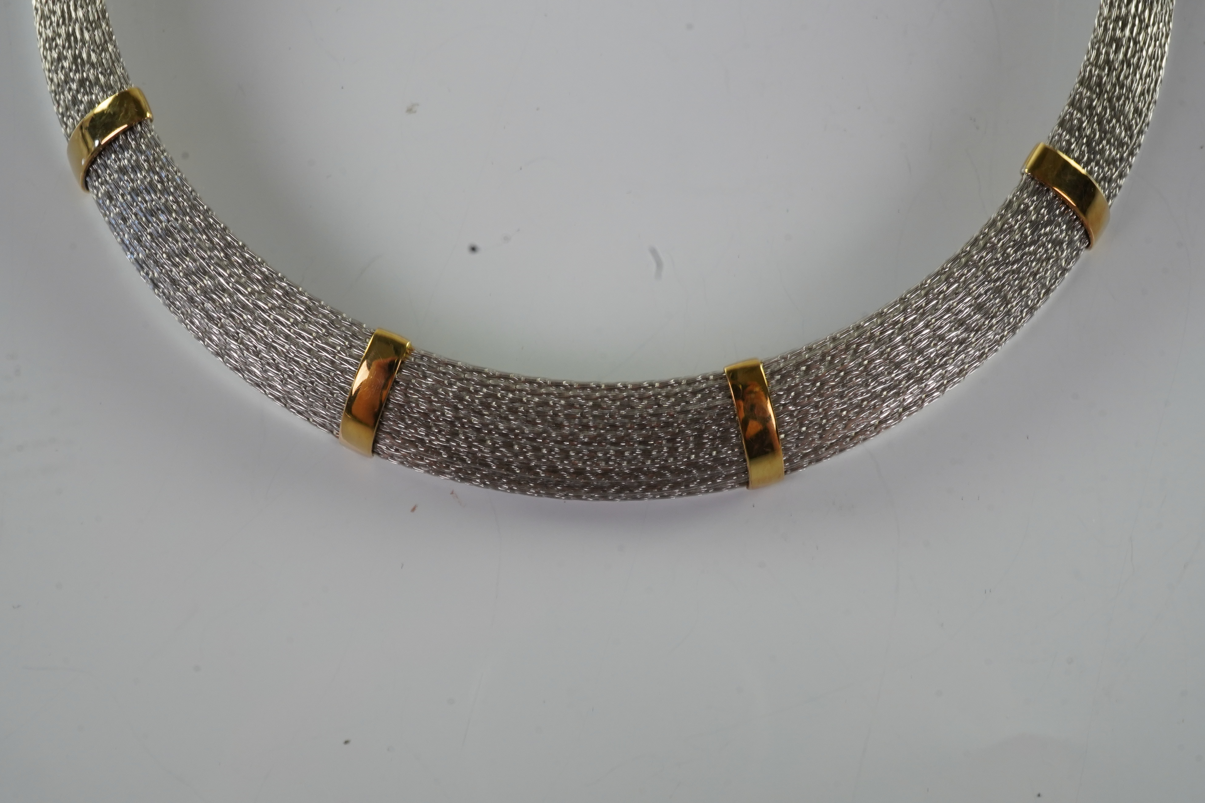 An 18ct gold collar and bangle